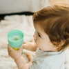 image:imageDr Browns Milestones Cheers 360 Spoutless Transition Cup with Handles Travel Friendly and Leak Free Sippy Blue Animals 7 oz200 mL BPAFree 6m 1Pack2Pack Blue  Green Animals  10 oz