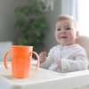 image:imageDr Browns Milestones Cheers 360 Spoutless Transition Cup with Handles Travel Friendly and Leak Free Sippy for Babies and Toddlers Pink BPAFree 7 oz200 mL 6mCoral